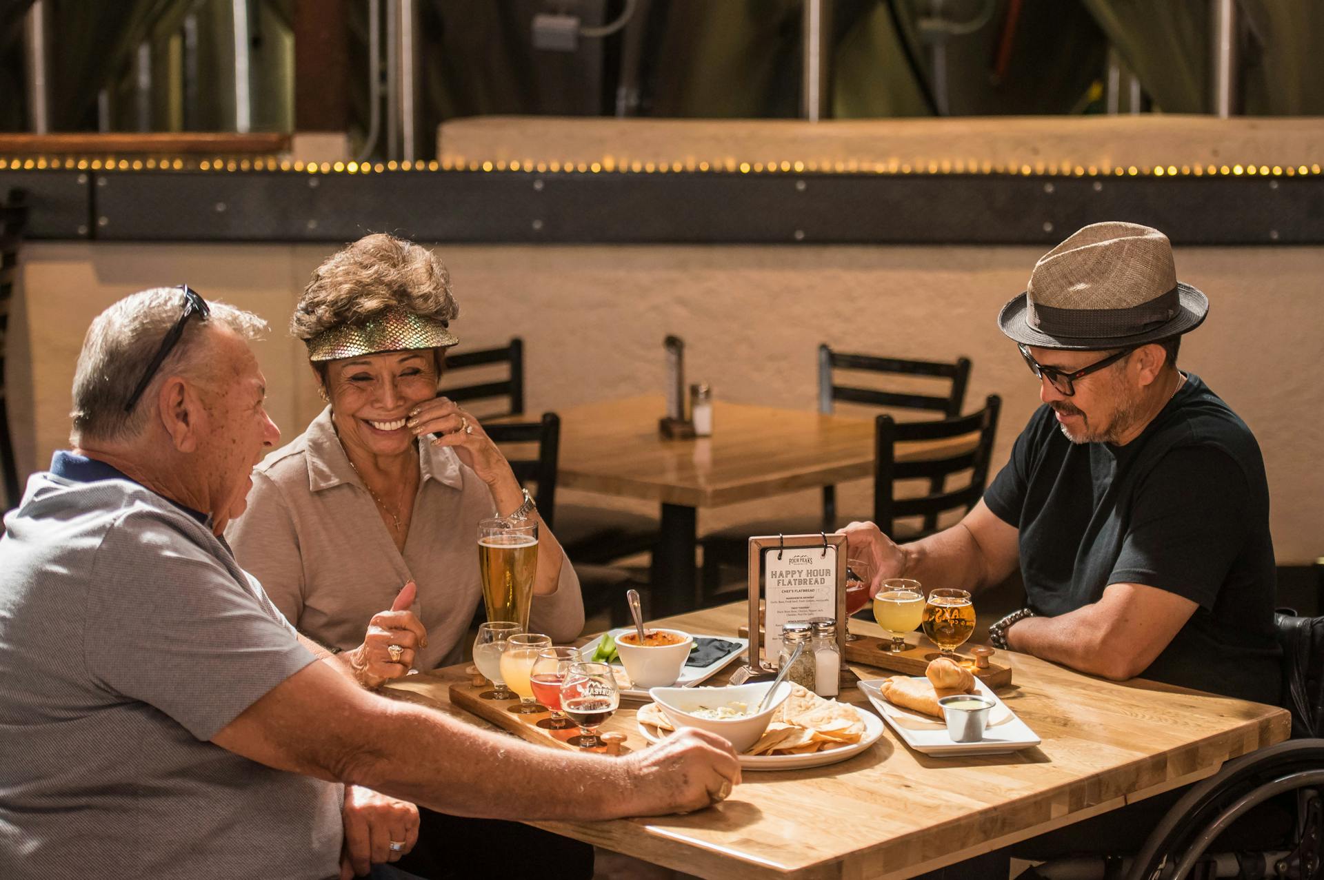 Three people drinking beer and having fun